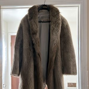 This is a genuine Beaver coat. It's very warm. Looks good with a good denim jean